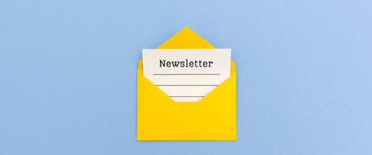 Yellow envelope on a blue background, with a piece of paper with the word 'newsletter'.