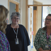 The Minister for Mental Health and Wellbeing talks to the Chair of Governors and Head Teacher at Ysgol Maes y Coed.