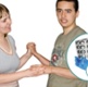 A carer holds the hands of a service user with a learning disability.