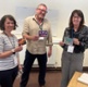 Members of the Programme Board holding postcards which formed part of a workshop activity.