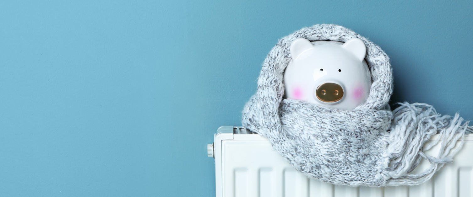 Polar Bear on a radiator with a scarf on with a blue background