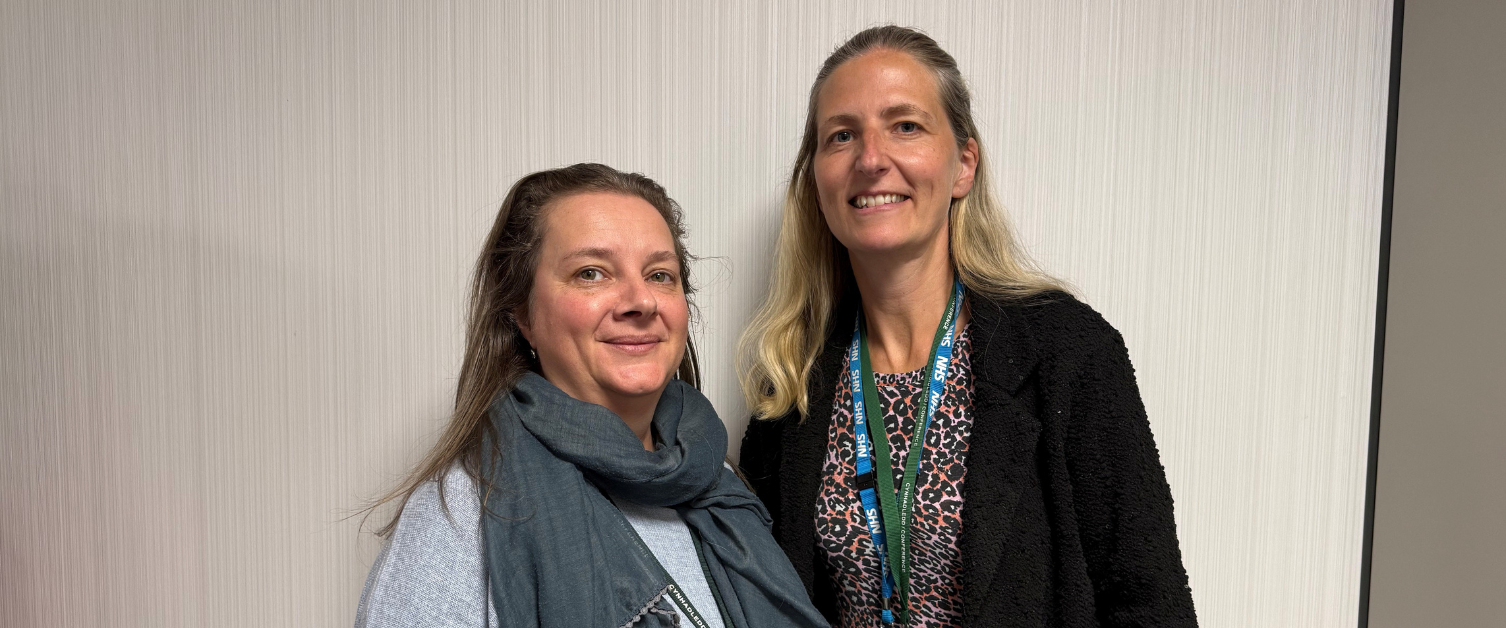 Two women are smiling.
