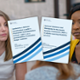 Two support workers are facing a service user. A report is placed in front of the image.