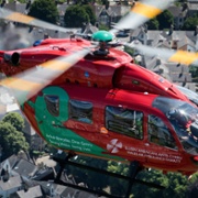 A picture of a Wales Air Ambulance in flight